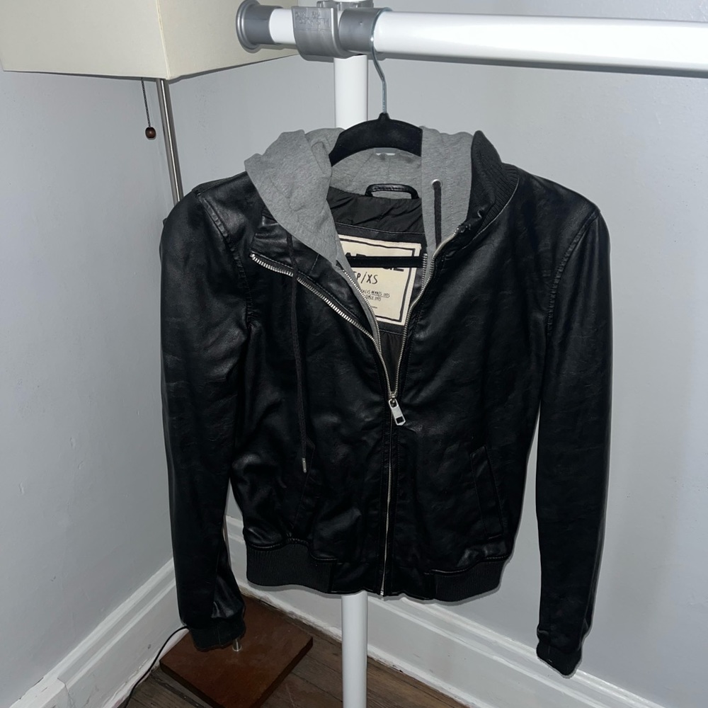 Garage leather jacket with gray sweatshirt lining. Super cute and gently used.